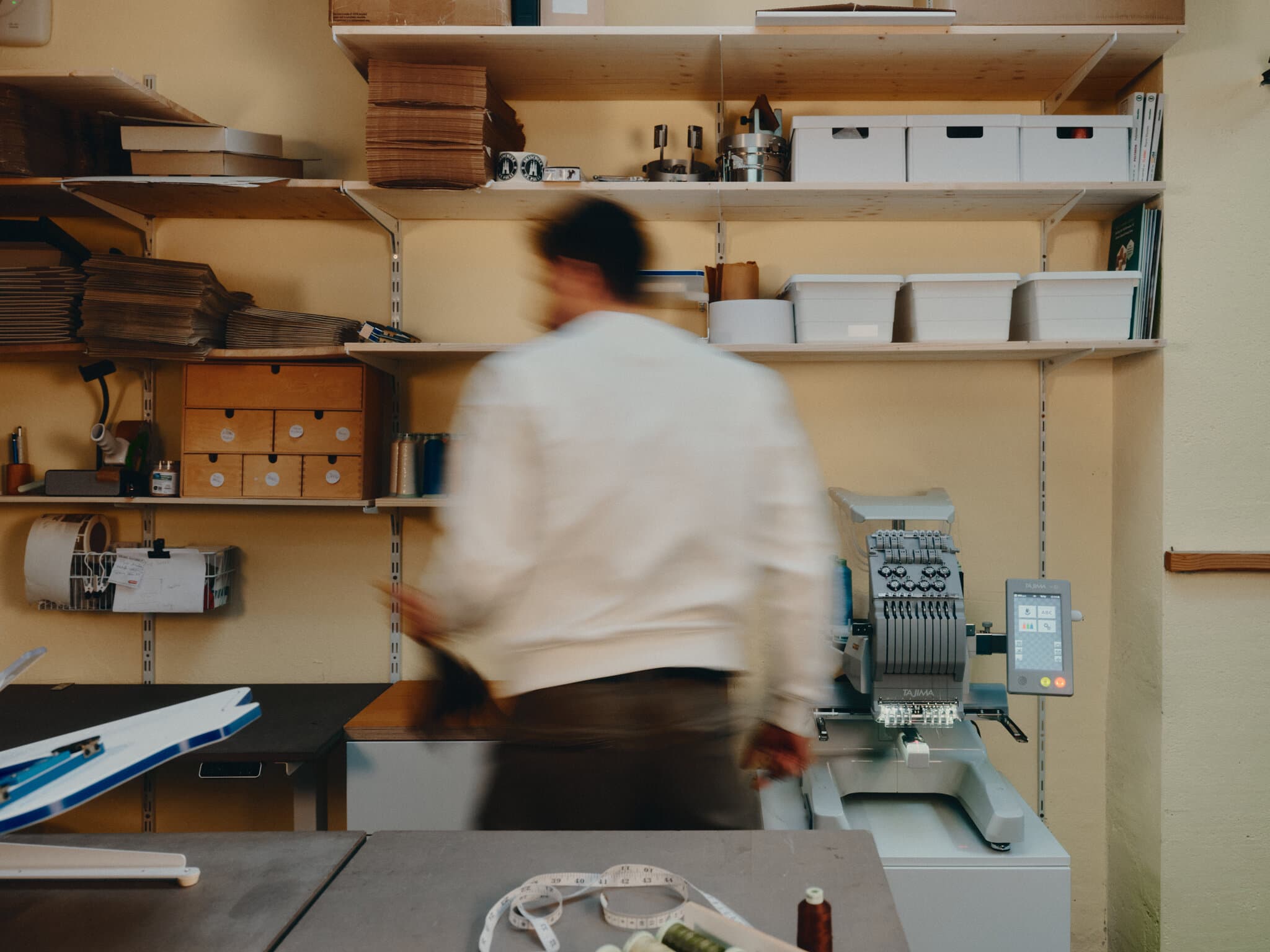 Max in front of the stitching machine.