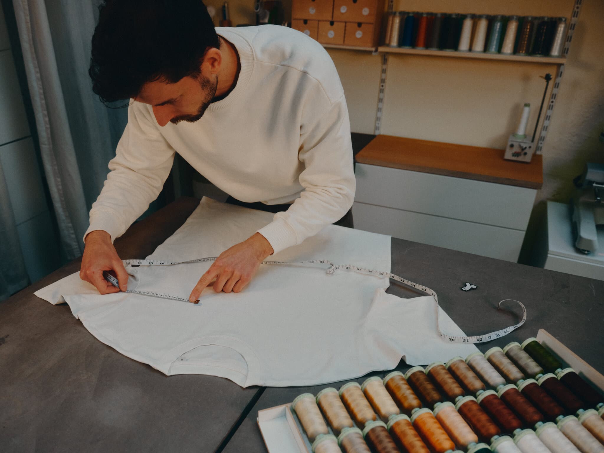 Max measuring the position on a tshirt