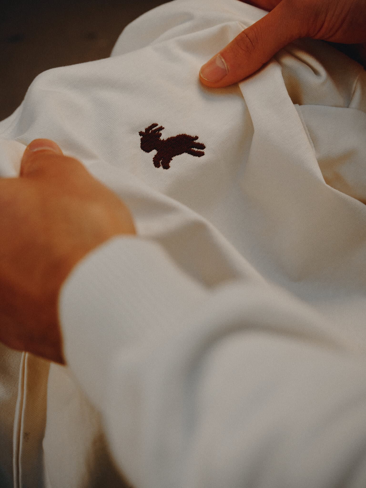 Max measuring the position on a tshirt